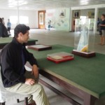 James sits to contemplate the armistice document, in an appropriately blurry photo