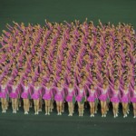 A cheery goodbye. So much more charming when waved by multiple regimented blocks of 400 girls in pink skirts